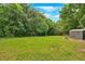 Expansive backyard with lush greenery, offering ample space for outdoor activities at 104 Gilreath Rd, Cartersville, GA 30121