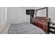 Cozy bedroom with hardwood floors, dresser with mirror, TV, and natural light at 104 Gilreath Rd, Cartersville, GA 30121