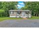 Charming single-story home features neutral siding, black shutters, and a welcoming front porch at 104 Gilreath Rd, Cartersville, GA 30121