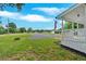 A nice angle of the front yard with a gravel circle drive and home in the distance at 104 Gilreath Rd, Cartersville, GA 30121