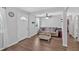 Bright living room with laminate floors, complemented by a neutral sofa and front door access at 104 Gilreath Rd, Cartersville, GA 30121