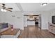 Open living room flows into a kitchen with stainless steel appliances and white cabinetry at 104 Gilreath Rd, Cartersville, GA 30121