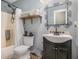 Bathroom with tub and shower combination with cabinet sink and patterned mirror and shelf at 270 Meadow View Dr, Grayson, GA 30017