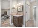 Charming half bath features modern vanity, decorative mirror, and neutral color palette at 270 Meadow View Dr, Grayson, GA 30017
