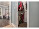 Bedroom view with walk-in closet, visible wood flooring, and queen sized bed at 270 Meadow View Dr, Grayson, GA 30017