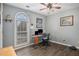 Bedroom with office space with natural light, wood floors, and ceiling fan at 270 Meadow View Dr, Grayson, GA 30017