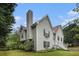 Charming two-story home with light green siding, chimney, and well-manicured landscaping at 270 Meadow View Dr, Grayson, GA 30017