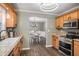 Modern kitchen with stainless steel appliances, granite countertops, and stylish wooden cabinets at 270 Meadow View Dr, Grayson, GA 30017