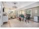 Living room featuring tile floors, a chandelier, a mini fridge, decor, and bright natural light at 270 Meadow View Dr, Grayson, GA 30017