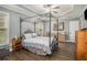Cozy main bedroom featuring tray ceiling, hardwood floors, and neutral color palette at 270 Meadow View Dr, Grayson, GA 30017