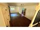 A view of the basement featuring dark hardwood floors and a glass sliding door at 2390 Tiffany Pl, Decatur, GA 30035