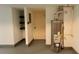 Basement with water heater features painted floors and unfinished storage area at 2390 Tiffany Pl, Decatur, GA 30035