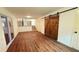 A view of the basement featuring barn door and hardwood floors at 2390 Tiffany Pl, Decatur, GA 30035