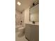 Recently remodeled bathroom featuring a stylish vanity, white fixtures, and a marbled subway tile shower at 2390 Tiffany Pl, Decatur, GA 30035