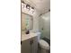 Updated bathroom features stylish vanity, modern fixtures, and a shower with glass door at 2390 Tiffany Pl, Decatur, GA 30035