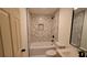 Recently remodeled bathroom features modern fixtures and a marbled subway tile shower at 2390 Tiffany Pl, Decatur, GA 30035