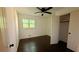 Bedroom with hardwood floors, closet, and ample natural light at 2390 Tiffany Pl, Decatur, GA 30035