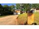 Charming brick home featuring a two-car garage, well-maintained lawn, and mailbox with visible street number at 2390 Tiffany Pl, Decatur, GA 30035