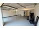 Two-car garage with tall ceilings, painted floors, and extra storage space at 2390 Tiffany Pl, Decatur, GA 30035