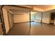 Spacious two-car garage with storage capacity features tall ceilings and freshly painted floors at 2390 Tiffany Pl, Decatur, GA 30035
