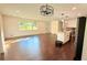 Bright and airy living room featuring hardwood floors and an open layout to the kitchen at 2390 Tiffany Pl, Decatur, GA 30035