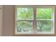 This is a close up of a window that offers a clear view of the outdoor greenery at 2390 Tiffany Pl, Decatur, GA 30035