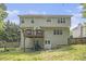 Exterior of home featuring a deck, backyard, a lawn mower, and a wooden fence at 263 Chandler Ridge Dr, Douglasville, GA 30134