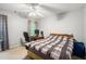 Simple bedroom with a ceiling fan, a window and space for a desk at 263 Chandler Ridge Dr, Douglasville, GA 30134