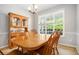 Traditional dining room features a wooden table, chairs, and a hutch at 263 Chandler Ridge Dr, Douglasville, GA 30134
