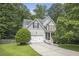 Charming two-story home featuring a manicured lawn and an attached two-car garage at 263 Chandler Ridge Dr, Douglasville, GA 30134