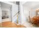 Bright foyer with hardwood floors, a staircase, and views into the dining and living areas at 263 Chandler Ridge Dr, Douglasville, GA 30134