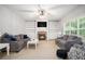Bright living room with built-in shelving, stone fireplace, and comfortable seating at 263 Chandler Ridge Dr, Douglasville, GA 30134