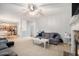 Spacious living room with a stone fireplace and neutral decor, open to kitchen at 263 Chandler Ridge Dr, Douglasville, GA 30134