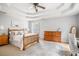 Comfortable main bedroom with ceiling fan, neutral decor, and lots of natural light at 263 Chandler Ridge Dr, Douglasville, GA 30134