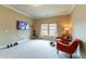 Inviting bonus room featuring comfortable seating and home exercise equipment at 366 Highbranch Cir, Lawrenceville, GA 30044