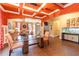 Elegant dining room featuring a modern chandelier, coffered ceiling, and views into the living area at 366 Highbranch Cir, Lawrenceville, GA 30044