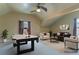 Upstairs game room with a pool table and seating area; perfect for entertainment and social gatherings at 366 Highbranch Cir, Lawrenceville, GA 30044