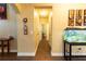 Hallway with access to different rooms, decorated with modern wall art and a fish tank at 366 Highbranch Cir, Lawrenceville, GA 30044