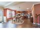 Spacious kitchen with modern appliances, wooden cabinetry, and a breakfast table setting; perfect for Gathering meals at 366 Highbranch Cir, Lawrenceville, GA 30044