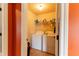Functional laundry room with appliances and built-in storage shelves at 366 Highbranch Cir, Lawrenceville, GA 30044