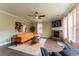 Cozy living room showcasing a fireplace, large windows, and a comfortable seating area at 366 Highbranch Cir, Lawrenceville, GA 30044