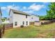 The backyard includes a storage shed, a view of the home, and a wooden fence at 10814 Wheeler Trce, Hampton, GA 30228