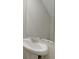 Close up on a bathroom sink with classic faucet and large mirror above at 10814 Wheeler Trce, Hampton, GA 30228