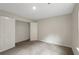This bedroom features plush carpet, neutral walls, and a closet, offering a serene and comfortable space at 10814 Wheeler Trce, Hampton, GA 30228