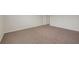A bright, spacious bedroom with carpet flooring and ample natural light at 10814 Wheeler Trce, Hampton, GA 30228