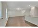 The living room features wood floors, and a ceiling fan creating a spacious and inviting atmosphere at 10814 Wheeler Trce, Hampton, GA 30228