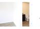 Bathroom showcasing a toilet, dark vanity with granite countertop, and wood-look flooring at 1612 Fuma Leaf Way, Mcdonough, GA 30253