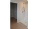 Modern bathroom featuring a glass shower and open walk-in closet at 1612 Fuma Leaf Way, Mcdonough, GA 30253