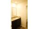 Bathroom with granite countertop vanity, undermount sinks, and luxury vinyl tile flooring at 1612 Fuma Leaf Way, Mcdonough, GA 30253