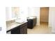 Bathroom featuring double sinks, granite counters, and a walk-in closet at 1612 Fuma Leaf Way, Mcdonough, GA 30253